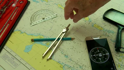 Nautical navigation instruments plotting a course Stock Footage 130558048