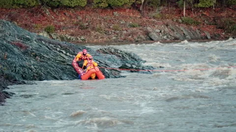 Nautical rescue team try to save a victim stuck on an island Video stock 56524837