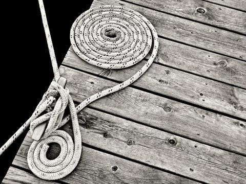 Nautical rope on dock Stock Photos