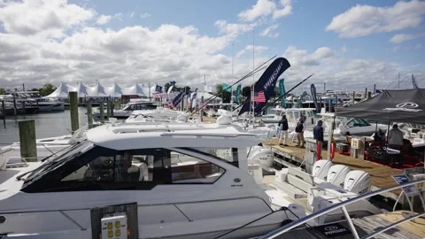 Nautical Showcase Features Luxury Yachts and Marine Displays Under Sunny Skies Vídeo Stock 346651930