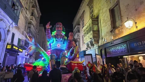 A nautical-themed float from the back with a smiling man and fish at the Malta Video stock 304564738