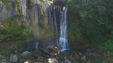 Nauyaca waterfalls cascading down mossy cliff in costa rica Stock Footage 339119094