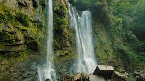 Nauyaca Waterfalls surrounded by rocky cliffs and rainforest in Costa Rica Stock-Footage 342771243
