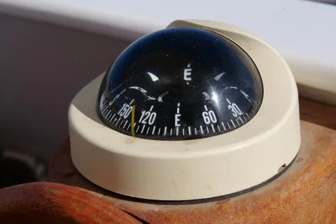 Naval compass on the ship Stock Photos