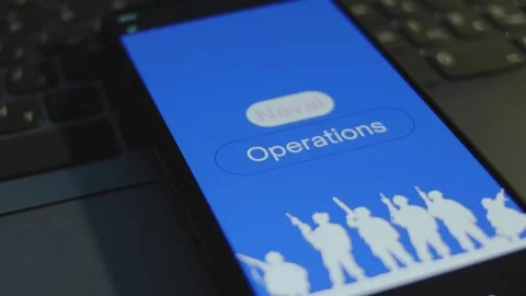 Naval Operations inscription on smartphone screen with blue background. Graphic Stock Footage 270966754