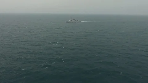 Naval ship navigating in the open ocean Stock Footage 113297761