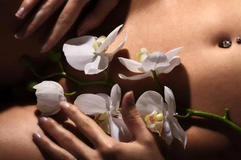 Navel with piercing Stock Photos