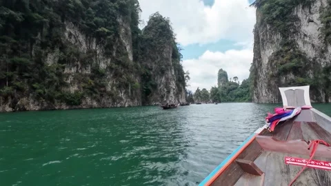 Navigating Between Limestone Cliffs by Longtail Boat Stock Footage 329073172
