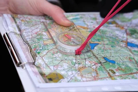 Navigating with map and compass Stock-Fotos