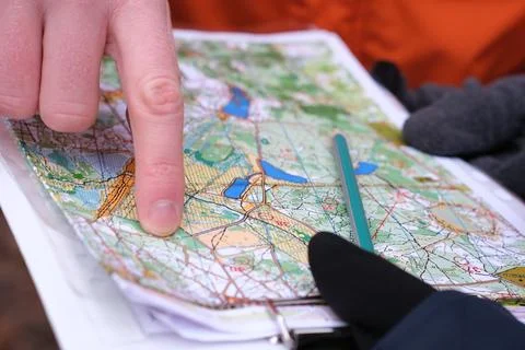 Navigating with map and compass Stock Photos