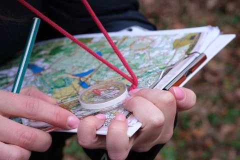 Navigating with map and compass Stock Photos