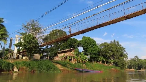 Navigating on a river passing under a bridge 1 Video stock 111233901
