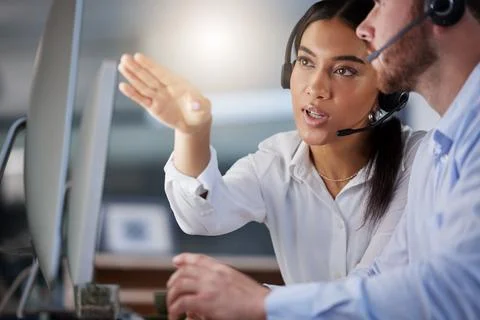Navigating their way to the right solutions. two call centre agents working Stock Photos