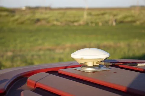 Navigation antenna on a special tractor for processing fields. Stock Photos