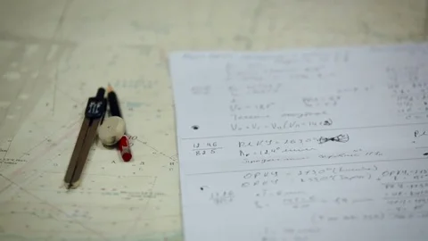 Navigation lessons. Map, pen, compass and calculations. Crane shot Stock Footage 84694862