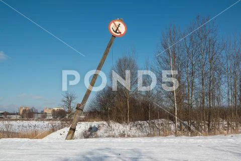Navigational old inclined river sign. No mooring sign on the river. Stock Photos