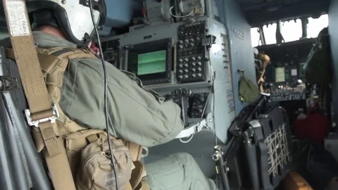 Navy aircrew operates a console aboard an MH-60R Sea Hawk helicopter Stock-Footage 93828484