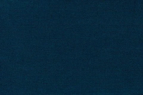 Navy blue background from a textile material with wicker pattern, closeup. Stock Photos