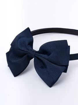 Navy blue bow headband, front view Stock Photos