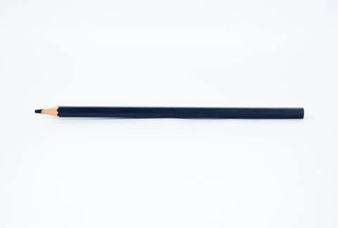 A navy blue colored sharp wood pencil crayon isolated on a white background Stock Photos