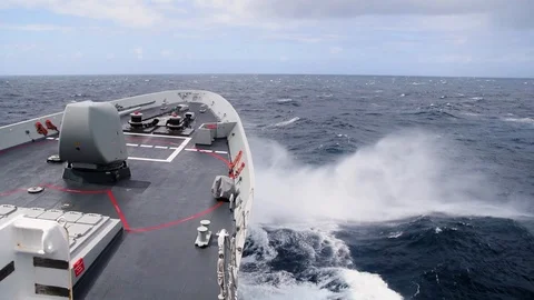 A Navy Destroyer underway through the Atlantic Ocean. View of the bow cutting Stock Footage 93430454
