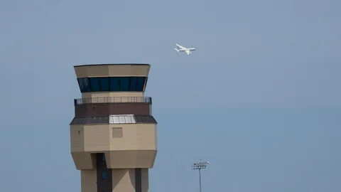 Navy E-6 Mercury flies by Tinker AFB Control Tower Stock Footage 110737681