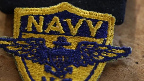 Navy Embroidered Patch On Table Close Up Tracking 스톡 동영상 145510640