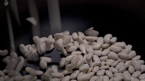 Navy haricot beans falling in saucepan Stock-Footage 88254694