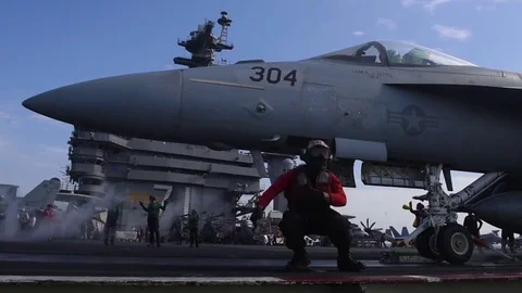 Navy jets take off from a U.S. aircraft carrier. Stock Footage 84329278
