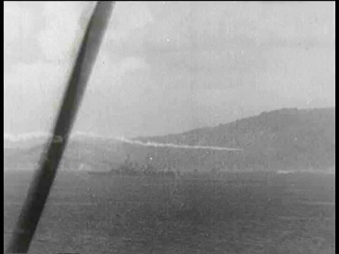 Navy landing craft arrive under cover of smoke screen.  The results of the Stock Footage 75097797