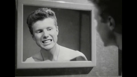 Navy man taking shower while talking to his friend - 1945 Stock Footage 101407286