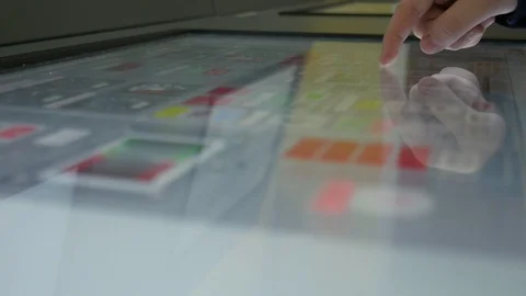 Navy man touching the screen of a big monitor in a moving merchant ship Stock Footage 106098612