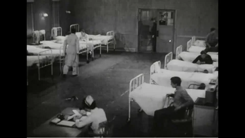 Navy men enter in naval training center barracks and help each other - 1945 Stock Footage 101407262