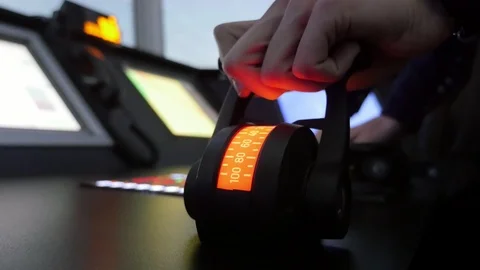 Navy officer pulling the handle of a semi-round route device in a merchant ship 스톡 동영상 106212808