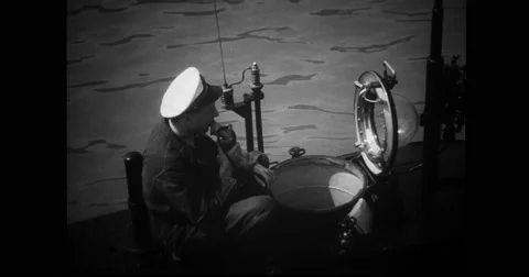 Navy officer sitting at the conning tower of French midget submarine Stock Footage