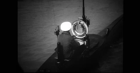 Navy officer sitting at the conning tower of French midget submarine Stock Footage
