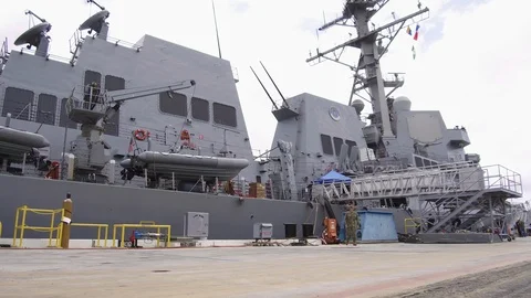 Navy officer walking on the dock Stock Footage 117733706