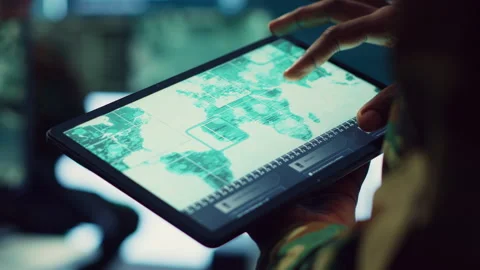 Navy operations specialist examines a world map with gps system on his tablet Stock Footage 276921016