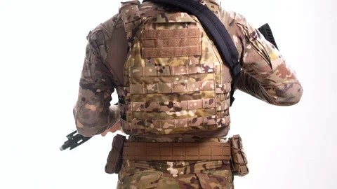 A Navy SEAL fighter picks up a combat rifle and turns to the camera Stock Footage 158013585