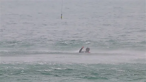 Navy seals training rescue people in the open sea with flying helicopter Видео 77124444