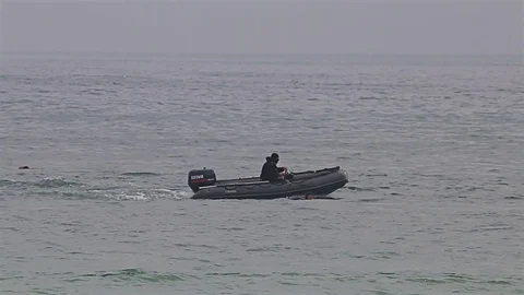 Navy seals training for terrorism attack in the sea with high speed motor boats Stock Footage 77125632