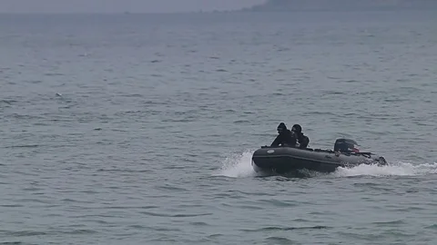 Navy seals training for terrorism attack in the sea with high speed motor boats Stock Footage 77126169