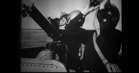 Navy soldiers on upper deck watching through binoculars Stock Footage