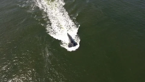 Navy submarine topdown half submersed 2 Stock Footage 90083835