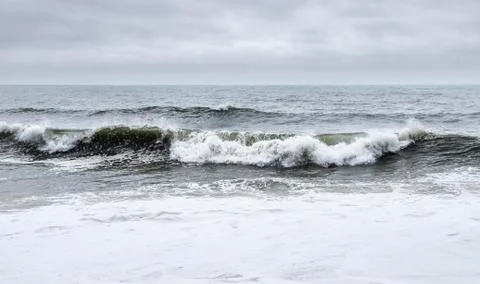 Nazare, Portugal - Crashing waves at the Praia do Norte or North beach Stock Photos