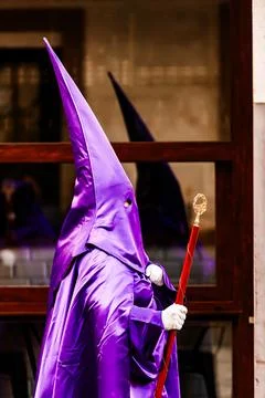 Nazarenes and their reflection in the procession of Good Friday in Villajoyos Stock Photos
