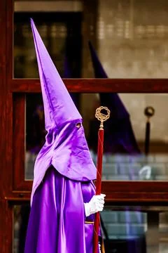 Nazarenes and their reflection in the procession of Good Friday in Villajoyos Stock Photos