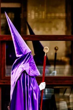 Nazarenes and their reflection in the procession of Good Friday in Villajoyos Stock Photos