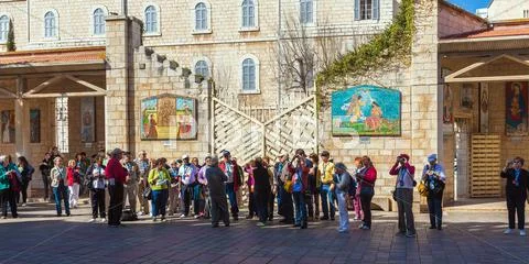NAZARETH, ISRAEL - FEBRUARY 21, 2013: Tourists near Annunciation Cathedral Stock Photos