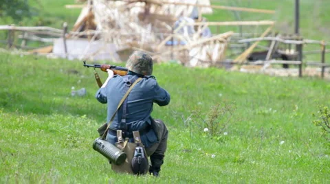Nazi soldier shooting from rifle Stock Footage